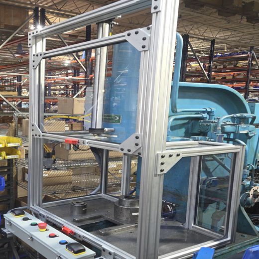 Assembly press with vertical door actuated with 2-hand controls Assembly press with vertical door actuated with 2-hand controls